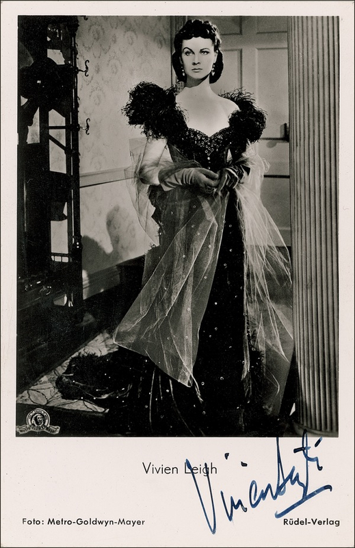 Lot 879 Gone With the Wind: Leigh, Vivien: Another day: Leigh signs a photo in her iconic role as Scarlett