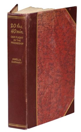 Lot #357 Amelia Earhart: ?LIKE A SACK OF POTATOES?: EARHART signs a limited edition memoir, complete with flown flag, of her history-making transatlantic flight - Image 1
