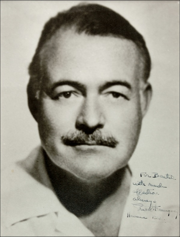 Lot 393 Ernest Hemingway: A TAMER LION: Scarce signed photo of Hemingway at the height of his later career, the year he won the Pulitzer Prize for The Old Man and the Sea