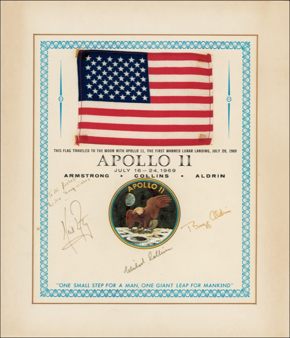 Lot 303 Apollo 11: RED, WHITE, AND BLUE: The members of the APOLLO 11 crew present an American flag carried to the moon during their historic mission