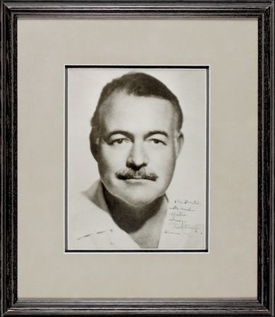Lot #393 Ernest Hemingway: A TAMER LION: Scarce signed photo of Hemingway at the height of his later career, the year he won the Pulitzer Prize for The Old Man and the Sea - Image 2