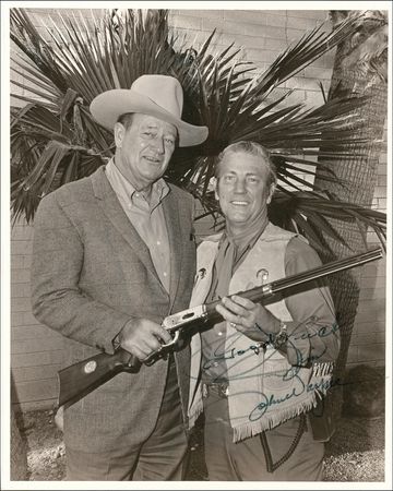 Lot #1060 John Wayne: THE COWBOY WAY: THE DUKE poses after winning his Academy Award for TRUE GRIT - Image 1