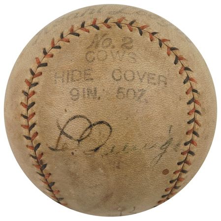 Lot #1402 Babe Ruth and Lou Gehrig: YANKEES IN JAPAN: The BAMBINO and the IRON HORSE sign a ball during their 1934 barnstorming tour of the Far East - Image 1