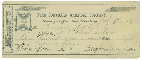 Lot 319 Brigham Young: One track mind: YOUNG signs a check as railroad executive