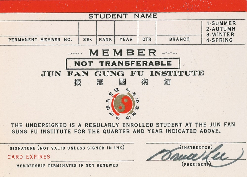 Lot 1191 Bruce Lee: FIST OF FURY: LEE signs a membership card for his martial arts school