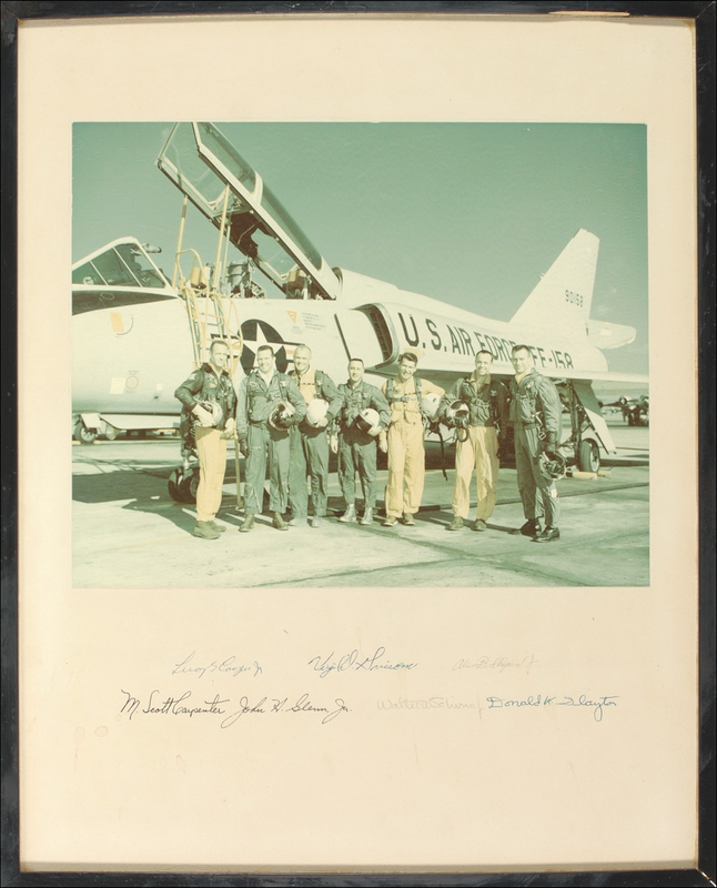 Lot 441 Mercury 7: The MERCURY SEVEN astronauts pose with a training aircraft