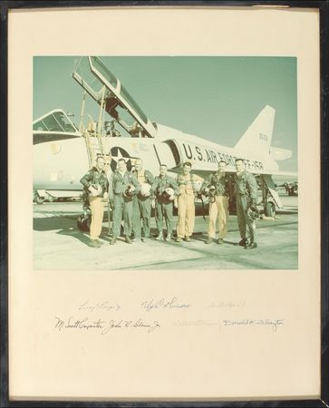 Lot #441 Mercury 7: The MERCURY SEVEN astronauts pose with a training aircraft - Image 1