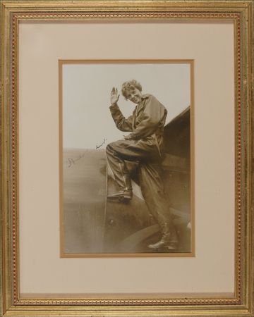 Lot #552 Amelia Earhart: The ?Queen of the Skies? signs an eye-catching and glossy period photograph - Image 1