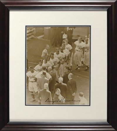 Lot #15 Dwight D. Eisenhower: Ike signs a photo