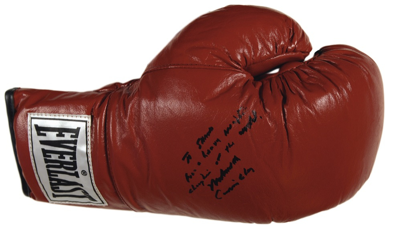 Lot 1167 Muhammad Ali: ?The Greatest? signs a tool of his trade with both names