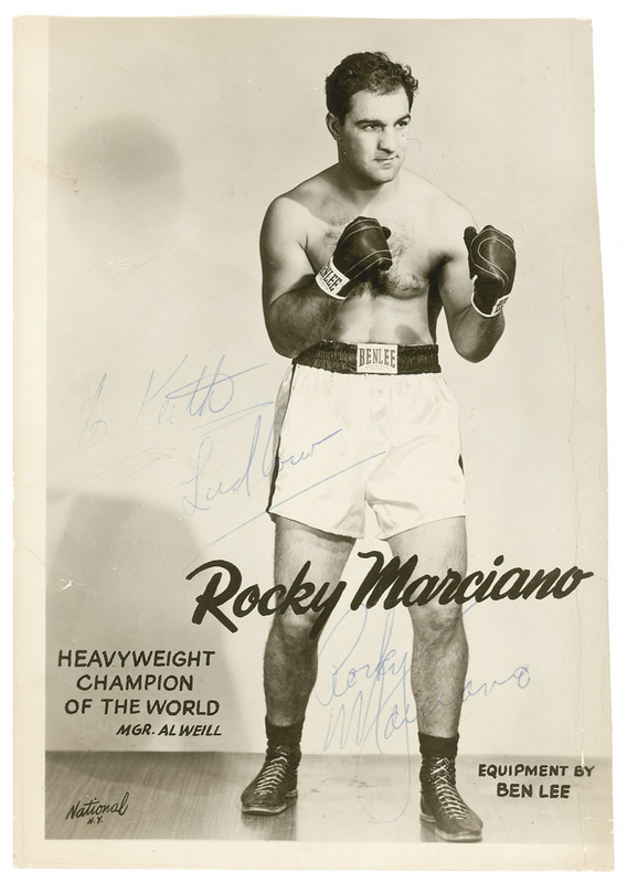 Lot 1288 Rocky Marciano: The ?Rock? signs for a fan