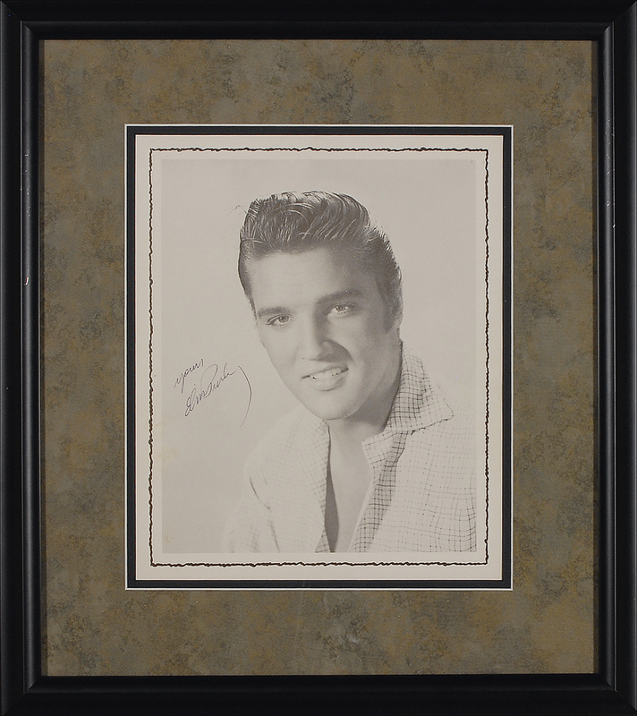 Lot 839 Elvis Presley: The King signs an early tour program photo