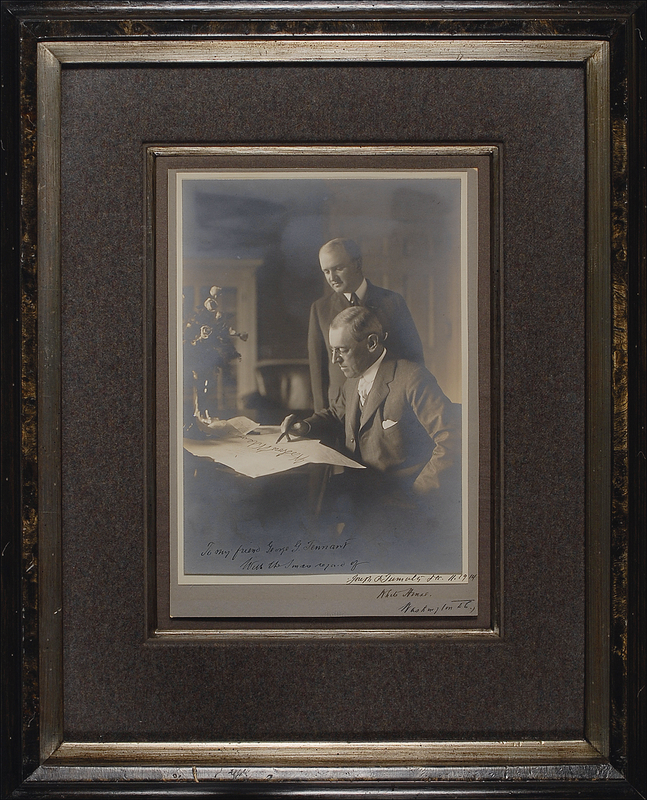 Lot 124 Woodrow Wilson: Wilson shows a sense of humor, situating his signature on the document he appears to be signing