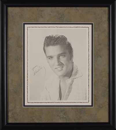 Lot #839 Elvis Presley: The King signs an early tour program photo - Image 1