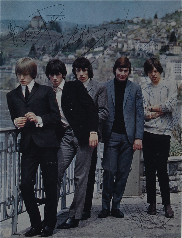Lot 801 Rolling Stones: The original Stones boldly sign a program photo
