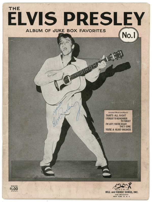Lot 796 Elvis Presley: Elvis signs a songbook while perched on the edge of superstardom