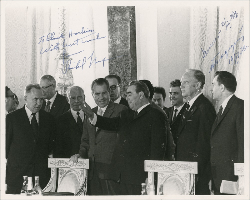 Lot 83 Richard Nixon: Nixon signs an original press photo during the Strategic Arms Limitations deliberations