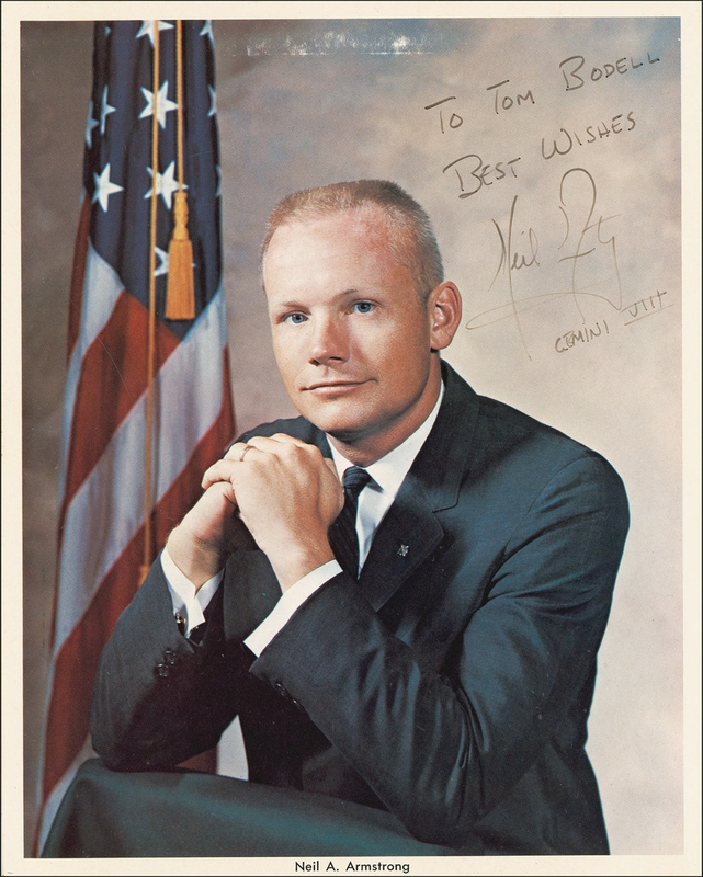 Lot 440 Neil Armstrong: Armstrong signs during his Gemini 8 homecoming
