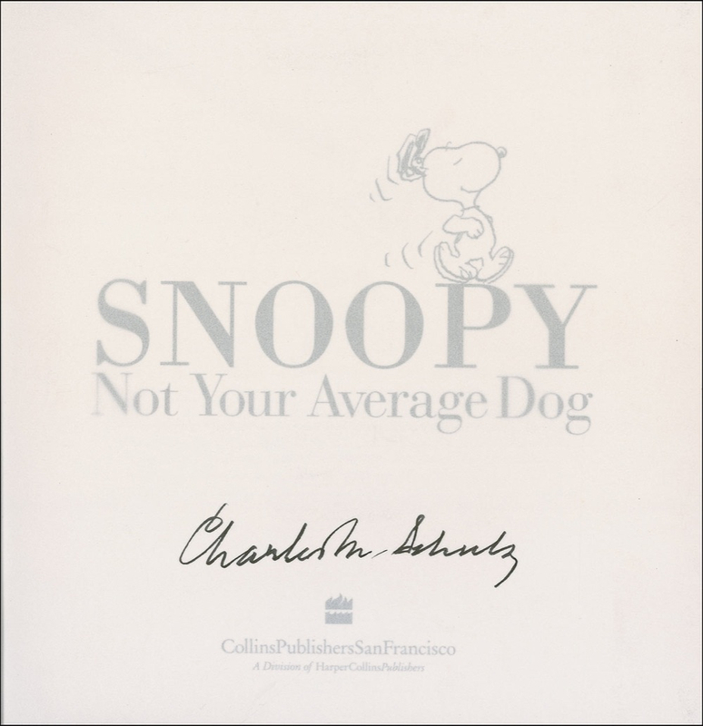 Lot 663 Charles Schulz: Schulz signs a limited edition copy of his Snoopy hardcover