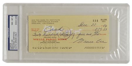Lot #1055 Bruce Lee: Prior to finding fame in The Green Hornet, the martial arts master gives a check to his new bride - Image 1