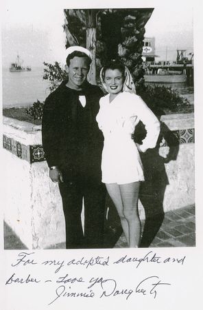 Lot #971 Marilyn Monroe: Jim Dougherty: Marilyn's first husband signs an image of the young couple and a catalog of her mementos - Image 1
