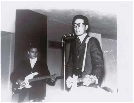 Lot #817 Buddy Holly: Holly signs a popcorn box on a cold Minnesota night during the ill-fated 1959 Winter Dance Party Tour - Image 2
