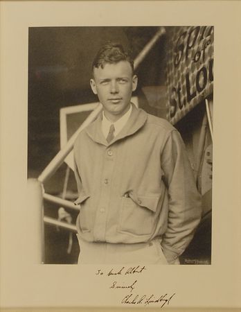 Lot #475 Charles Lindbergh: Exceptional oversized Underwood photo of Lindbergh posing with the Spirit of St. Louis - Image 1