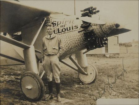 Lot #397 Charles Lindbergh: Lindbergh poses proudly with the Spirit of St. Louis - Image 2