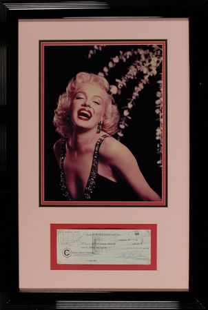 Lot #1337 Marilyn Monroe: Marilyn tends to business around the time of shooting Let?s Make Love - Image 1