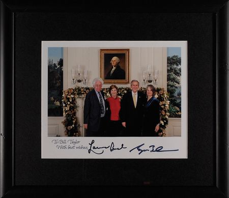 Lot #18 George W. and Laura Bush: Bush welcomes a
