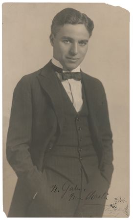 Lot #1020 Charlie Chaplin: Chaplin adds his trademark sketch of The Tramp to an oversized Pach Bros. portrait - Image 1