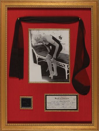 Lot #1208 Marilyn Monroe: Sexy Marilyn ensemble including a rent check, worn silk stocking, and hair from the night of ‘Happy Birthday, Mr. President’ - Image 1