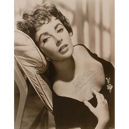 Lot #1129 Elizabeth Taylor: Gorgeous portrait of the sultry Taylor - Image 1