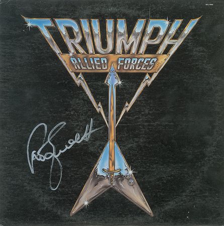 Lot #1062 Aerosmith and Triumph Albums - Image 1