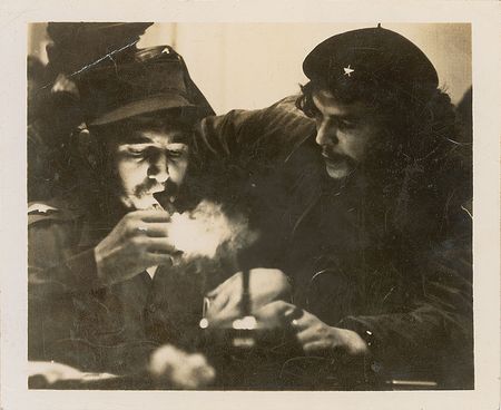 Lot #289 Che Guevara: Clad in his instantly-recognizable beret, Che joins Castro in a cigar - Image 1