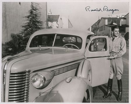 Lot #204 Ronald Reagan: Unique portrait of Reagan on a studio back lot signed for a grade-school classmate - Image 1
