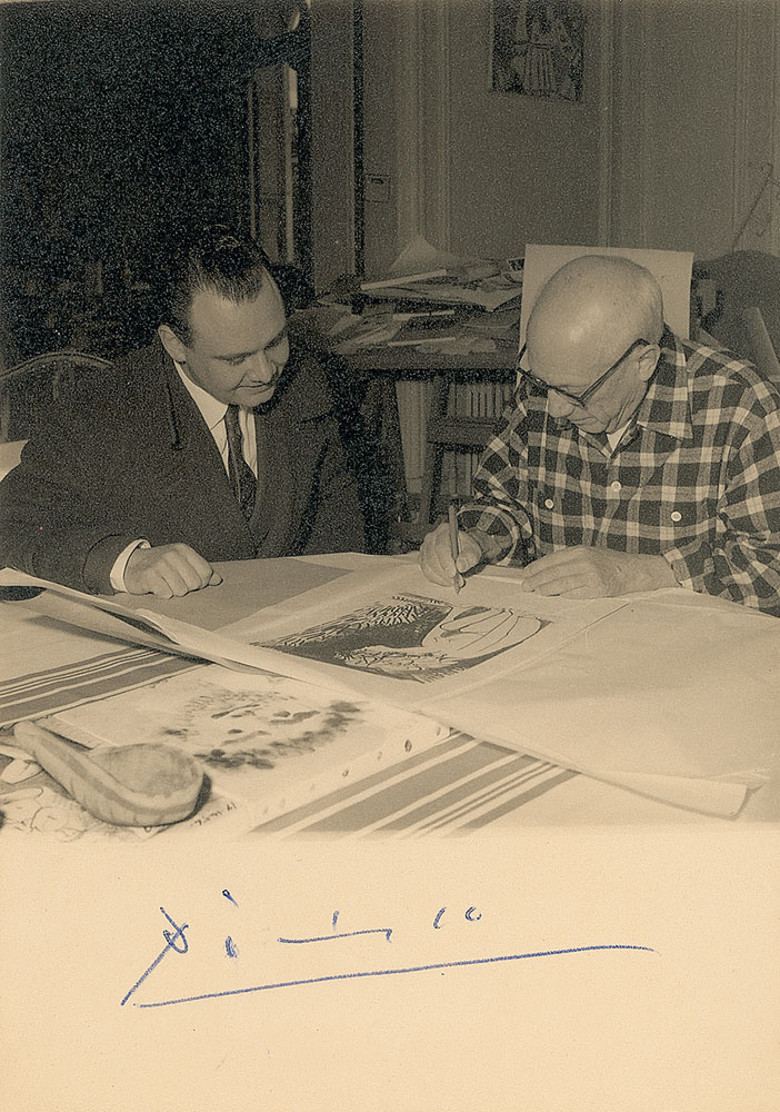 Lot 857 Pablo Picasso: Unusual photo of Picasso signing his works