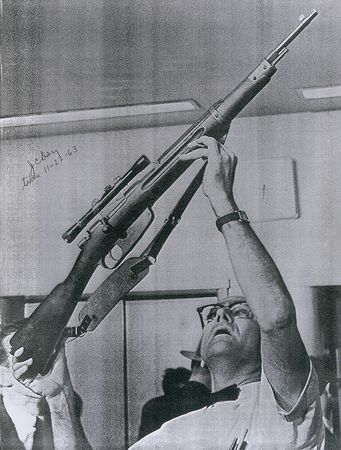 Lot #222 J. Carl Day Signed Photo Examining Oswald’s Rifle - Image 1