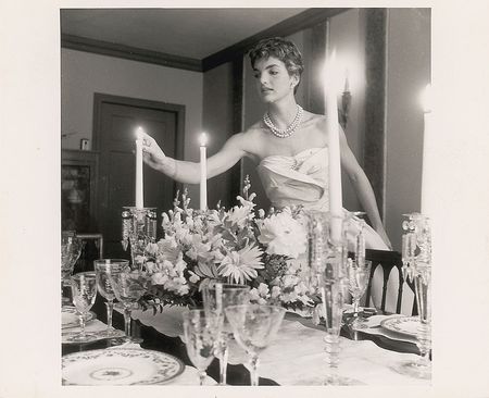 Lot #88 Jacqueline Kennedy Photograph Lighting the Candles for a Dinner Party - Image 1