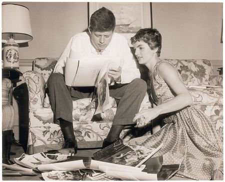 Lot #86 John and Jacqueline Kennedy Photograph Perusing Wedding Photos - Image 1