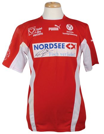 Lot #922 Michael Schumacher: Schumacher?s game-worn 2006 ?Spiel des Herzens? jersey - Image 1