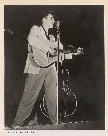 Lot #725 Elvis Presley: Great Elvis portrait signed for a young lady backstage in 1956, complete with over a dozen candids of Presley at the event - Image 1