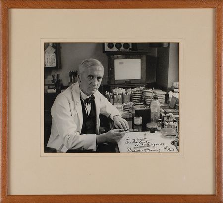 Lot #164 Alexander Fleming: Rare signed laboratory photograph, a bottle of penicillin on his desk - Image 1