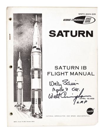 Lot #113 Schirra and Cunningham Signed Saturn IB Manual - Image 1