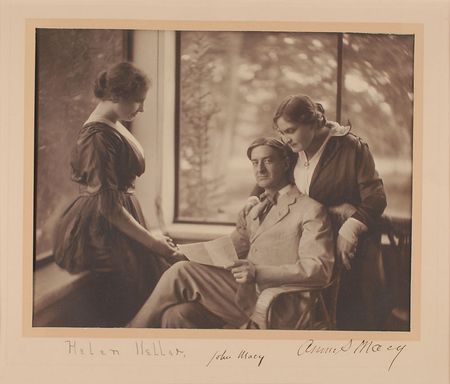 Lot #140 Helen Keller: Spectacular photograph of Keller’s editor signing into her hand, her tutor standing close by - Image 1