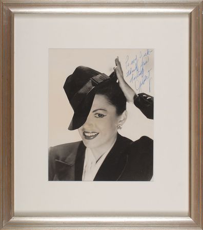 Lot #820 Judy Garland: Judy tips her cap - Image 1