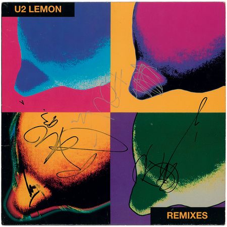 Lot #7513 U2 Signed Album - Image 1