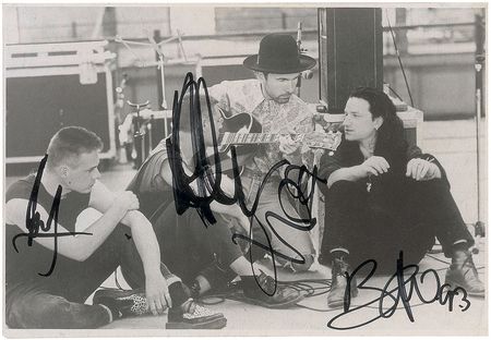 Lot #7512 U2 Signed Photograph - Image 1