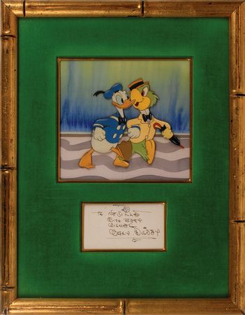 Lot #1102 Donald Duck and Jose Carioca production cel Saludos Amigos: Stupendous Courvoisier cel and Disney signature display - Image 1
