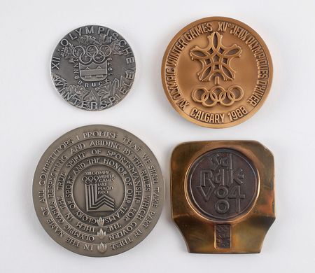 Lot #3101 Winter Participation Medal Collection: 1976 Innsbruck, 1980 Lake Placid, 1984 Sarajevo, 1988 Calgary - Image 1